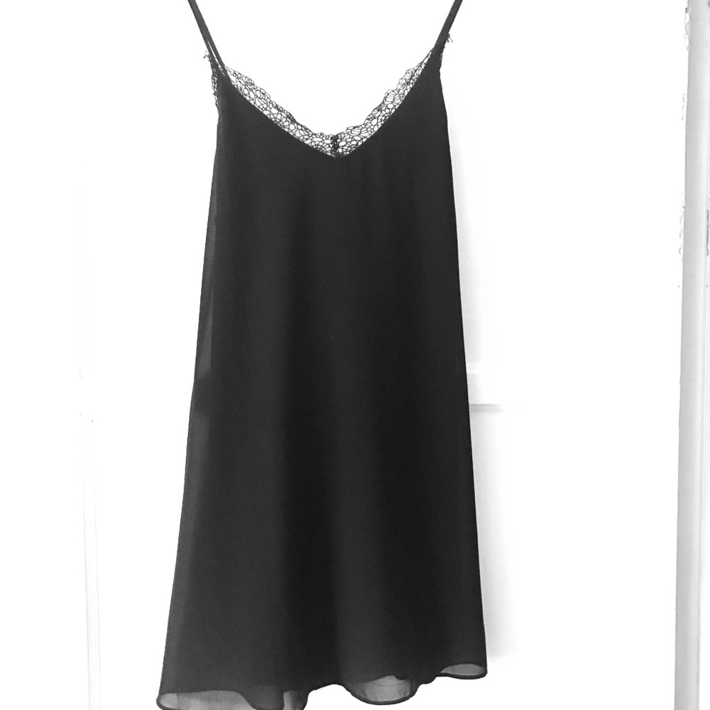 Black mini dress with lace detail, open low back